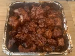 A picture of squares of pork belly with barbecue sauce on them